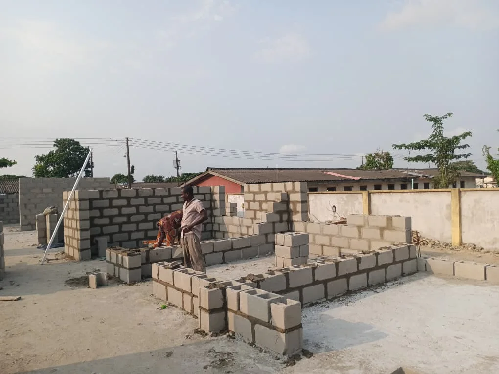 Low-level blockwork defining internal spaces. View 01.